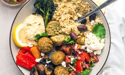Mediterranean Falafel Deluxe Bowl loaded with colorful vegetables